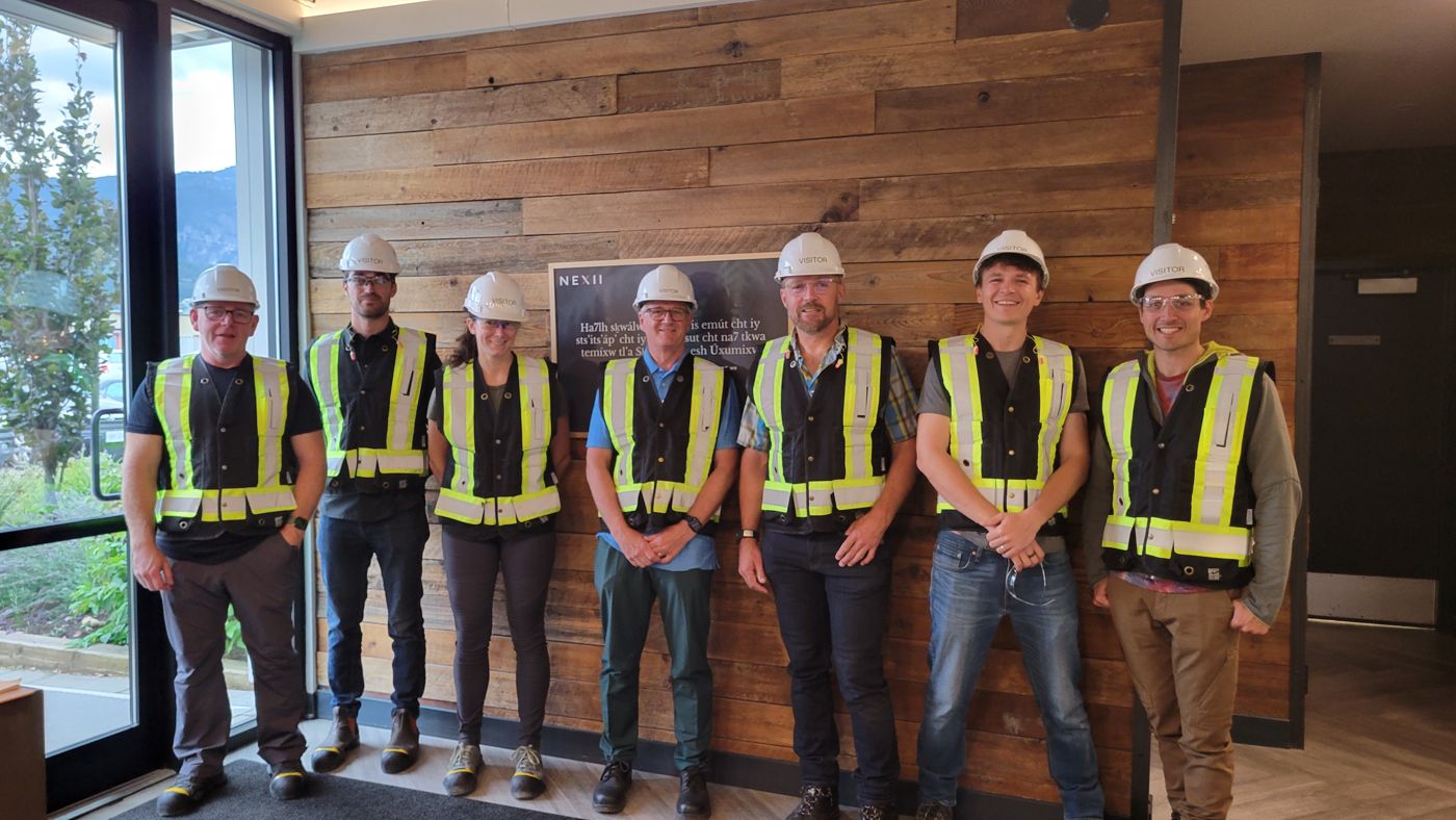 BISS members in hard hats and safety vests on a company visit